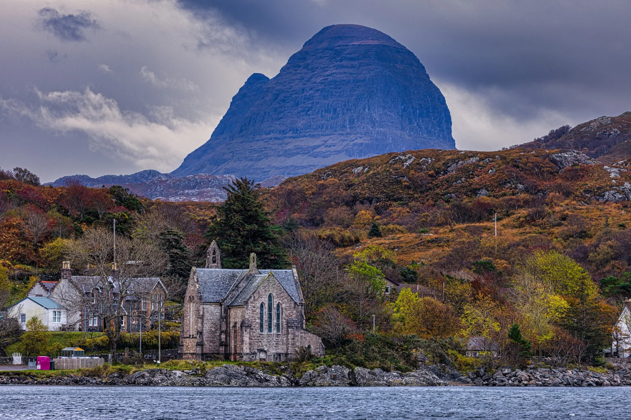 Suilven rising alone from open moorland in Assynt, north west Scottish Highlands