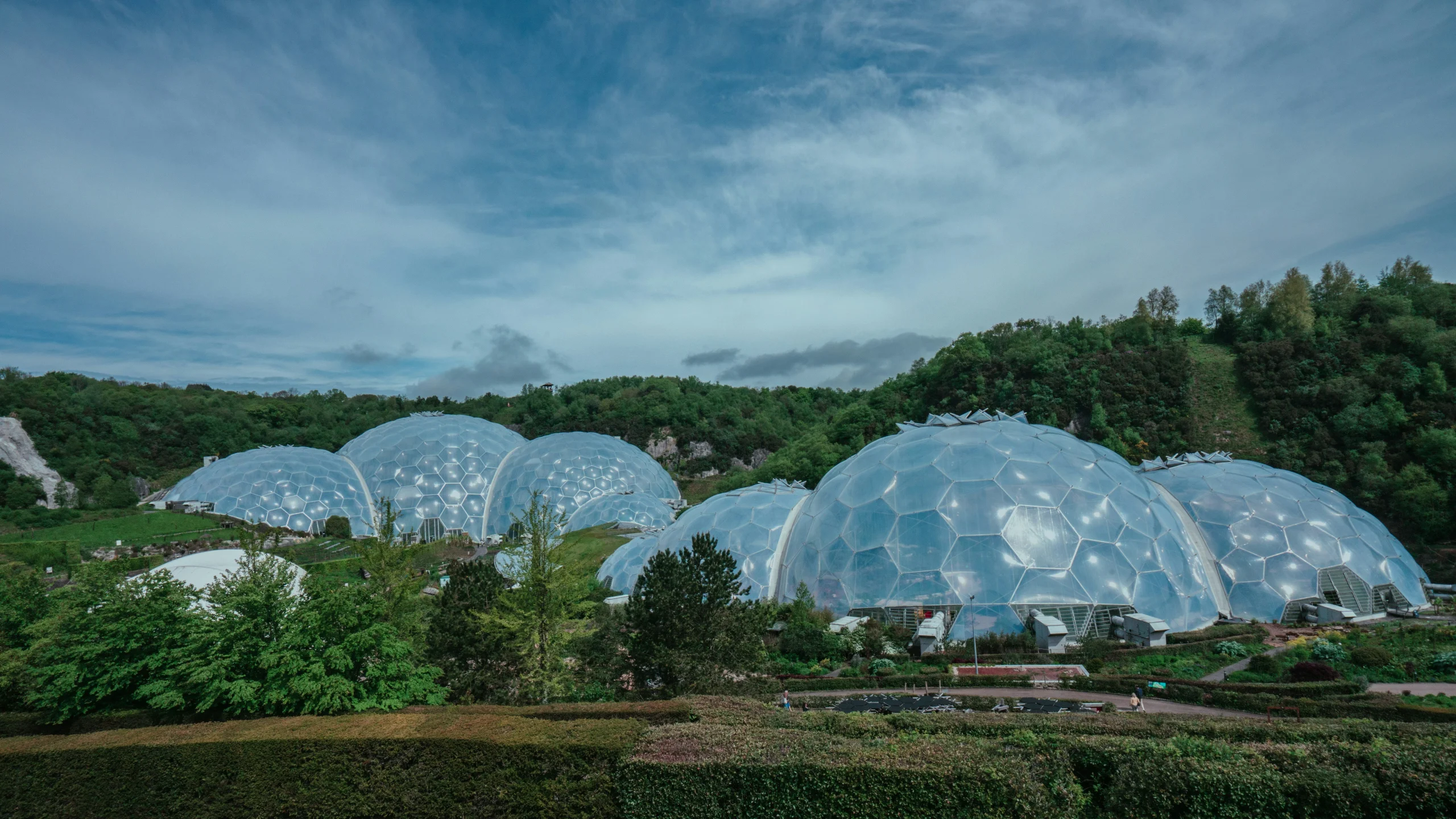 The giant dome-shaped biomes at the Eden Project near St Austell, Cornwall, set among gardens in a former clay pit