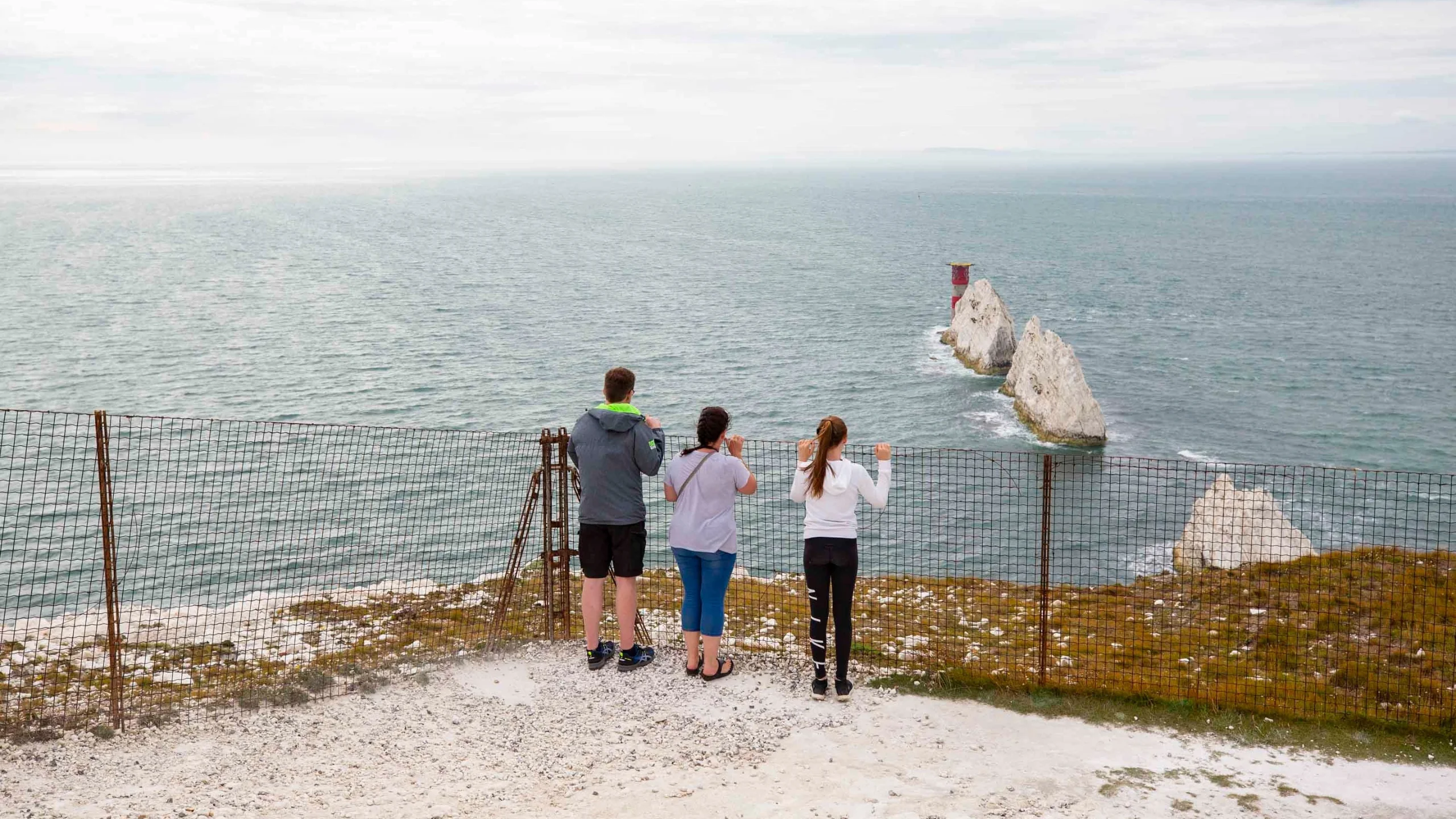 The Needles chalk stacks and red and white lighthouse off the western tip of the Isle of Wight, seen from the Old Battery