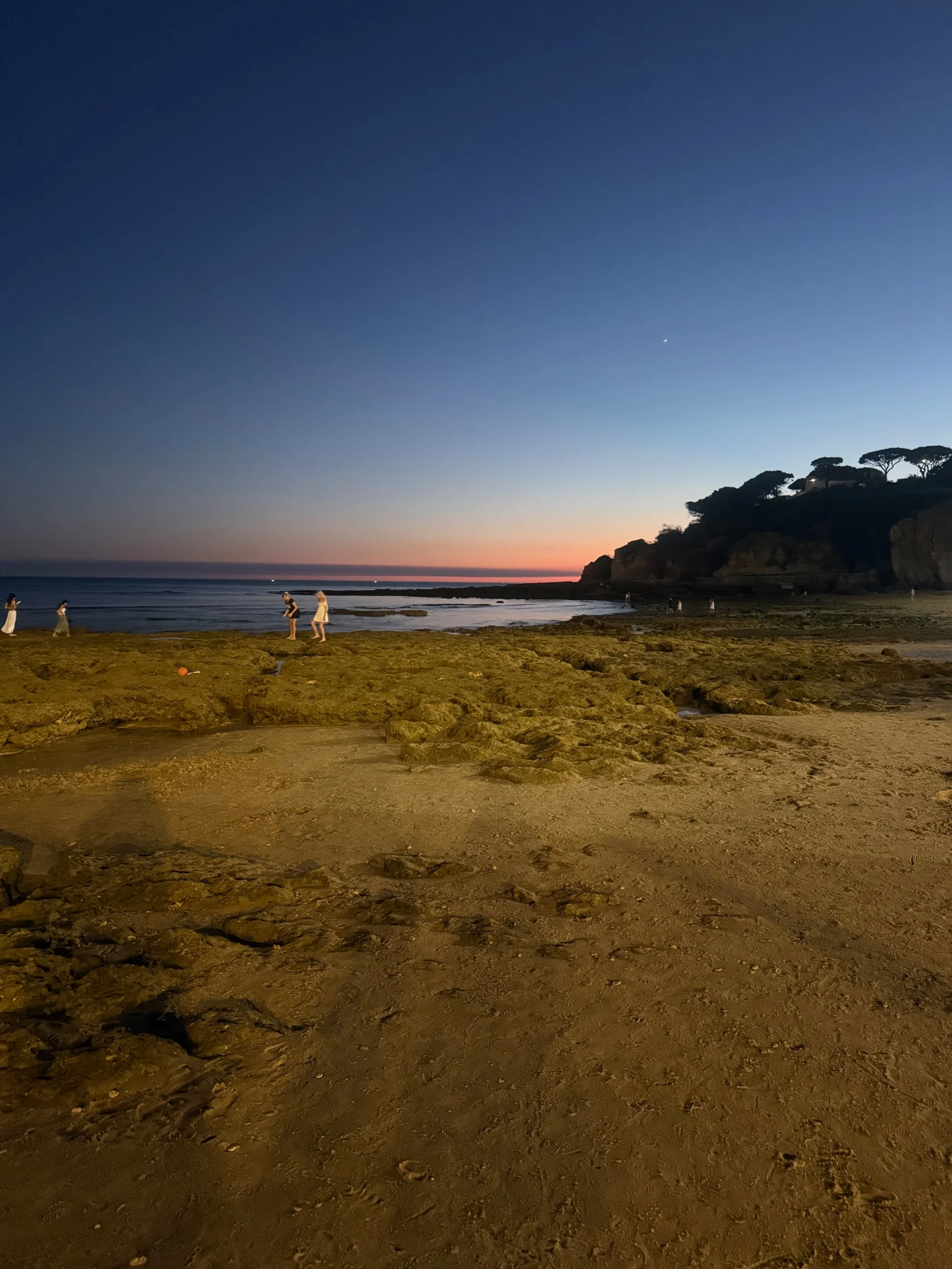 Praia dos Olhos de Água at sunset, the beach below the cliffs a short walk from 3HB Guaraná