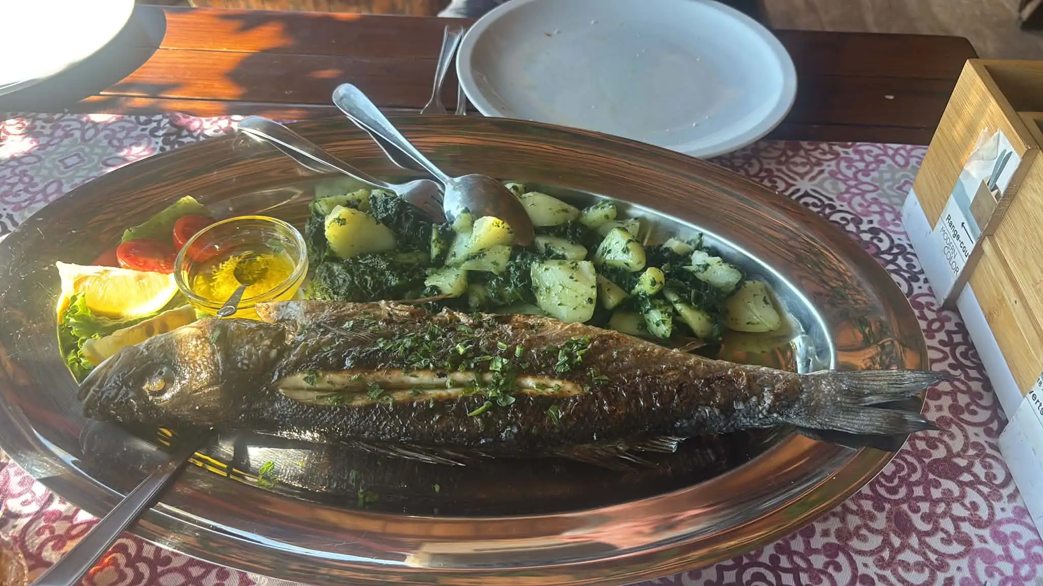 Whole fish cooked over coals at Mali Raj, Babine Kuće