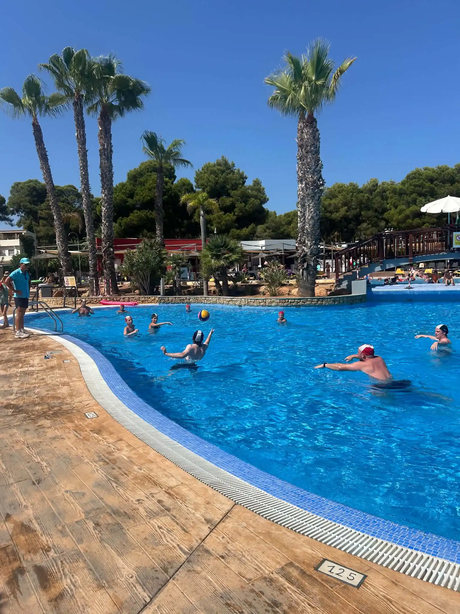 Activity pool lined with sunbeds at TUI Magic Life Cala Pada, Ibiza